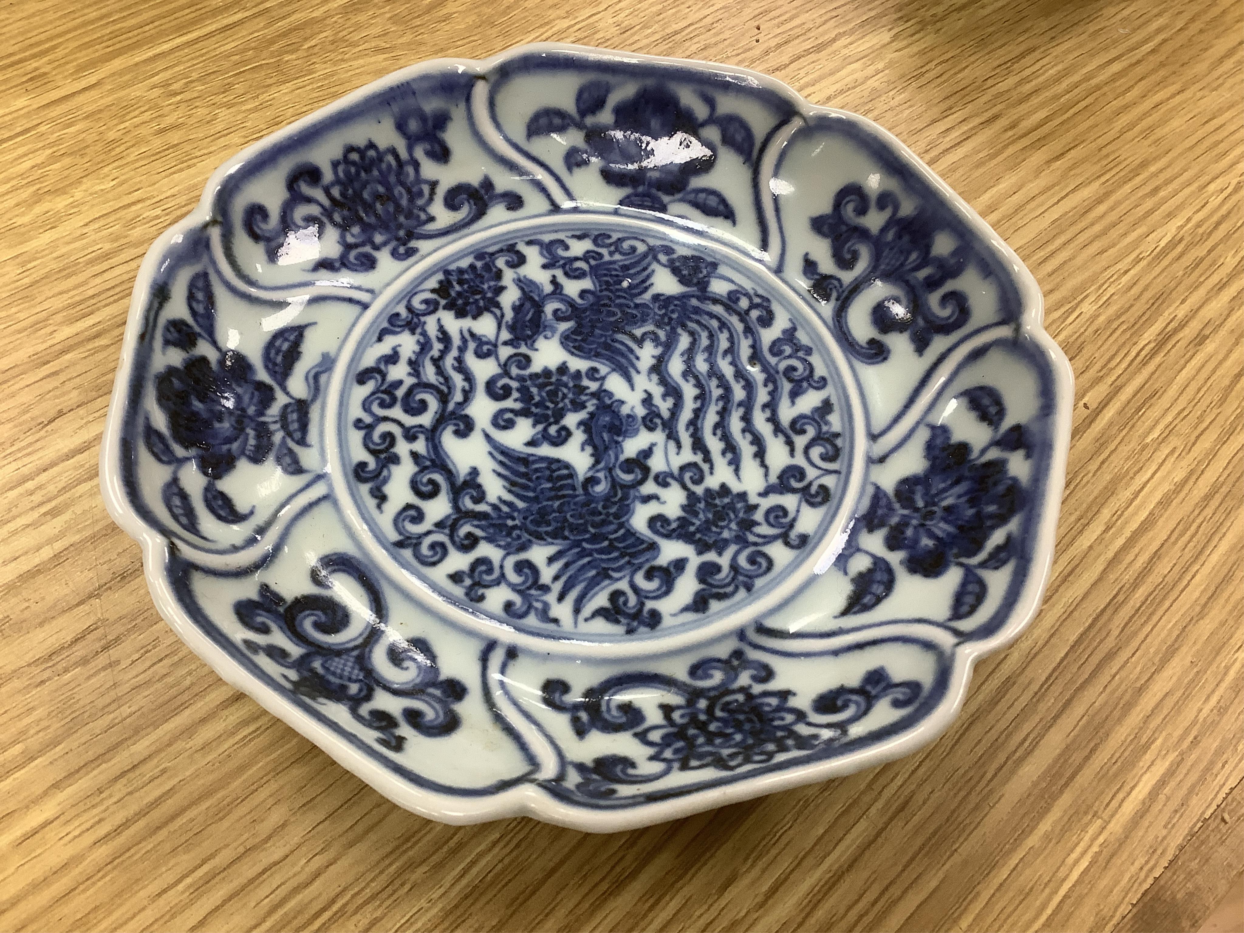 A Chinese copper red glazed dish, a blue and white bowl and a similar dish, bowl 22.5cm diameter. Condition - good